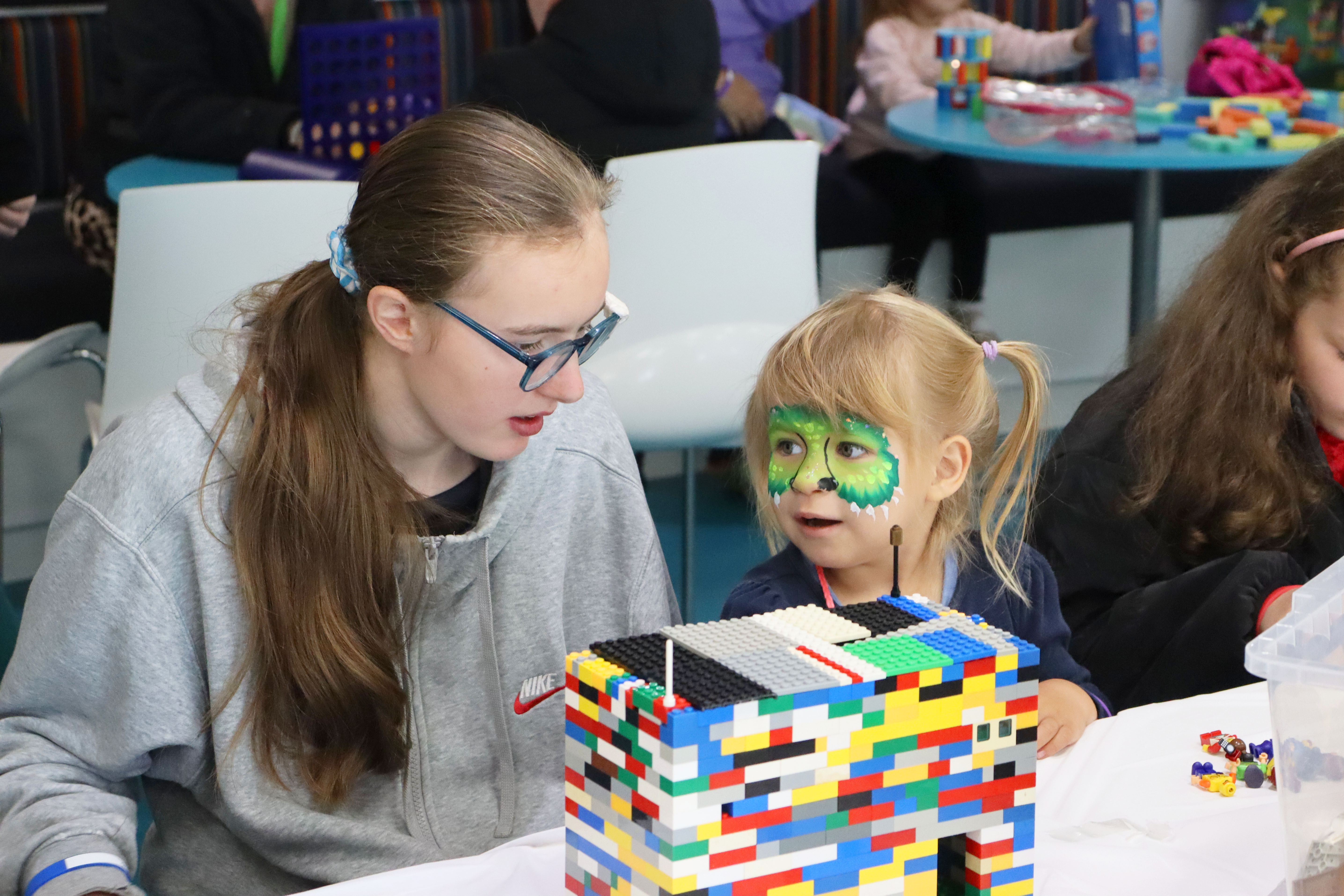 Children playing and building lego 