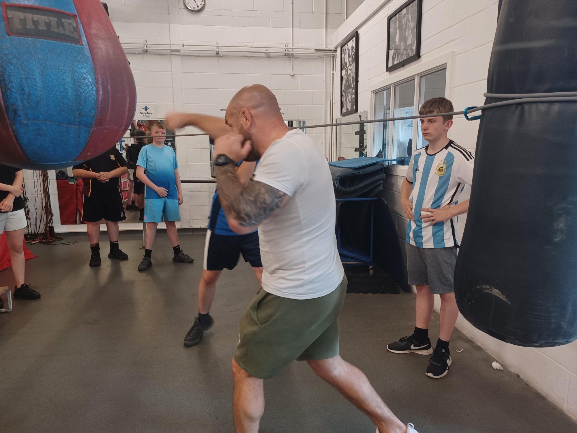 Boxing coach doing a demonstration