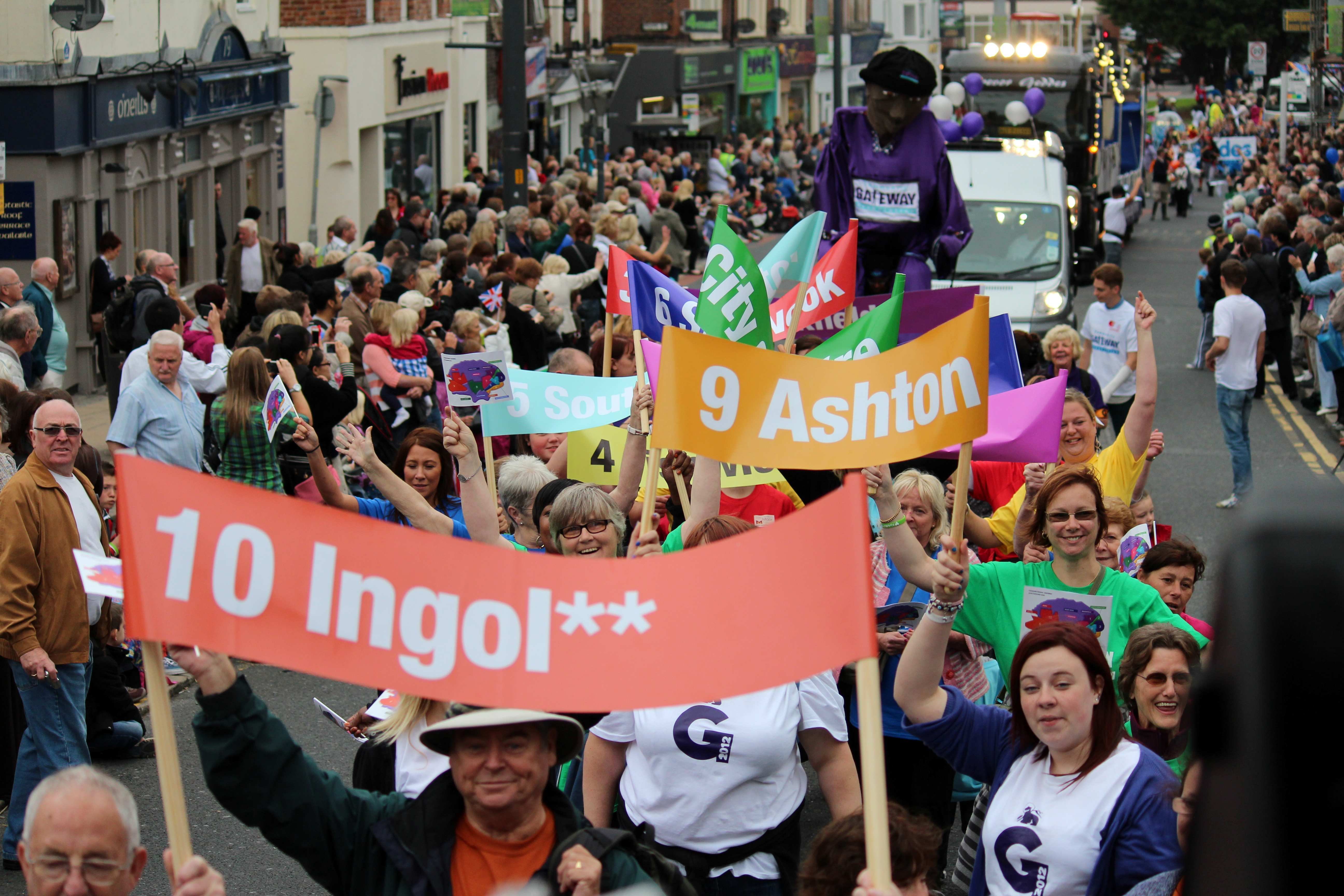 A large group walking with banners at Preston Guild 2012