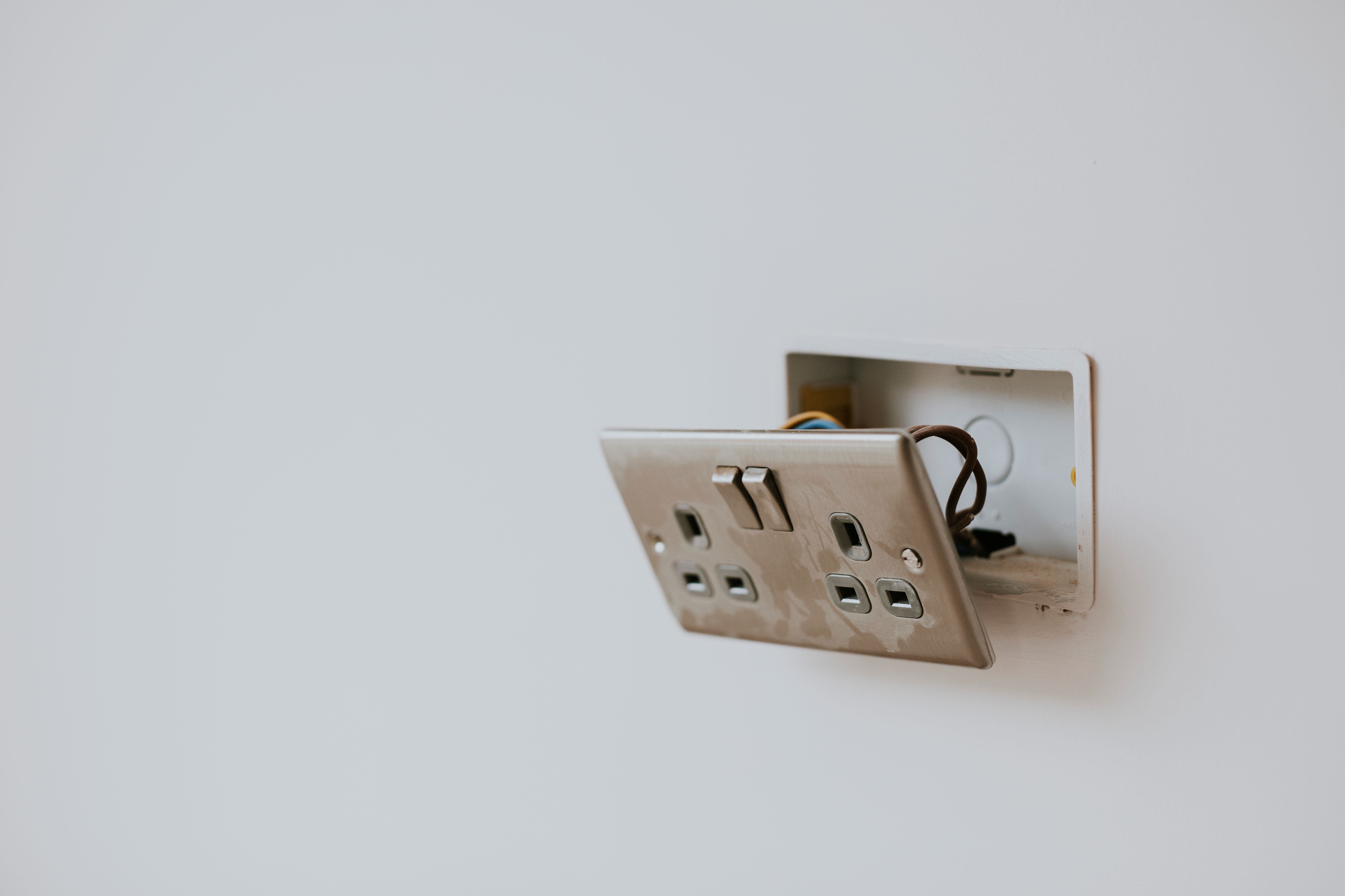 broken-power-outlet-wall