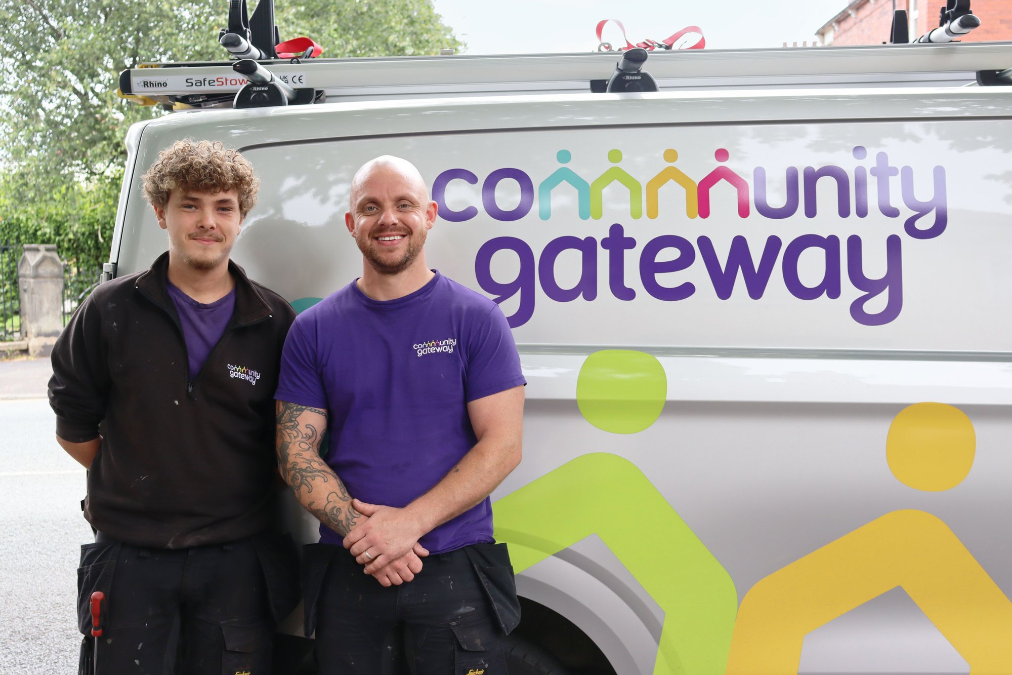 Two CGA gas operatives stood in front of a CGA branded van