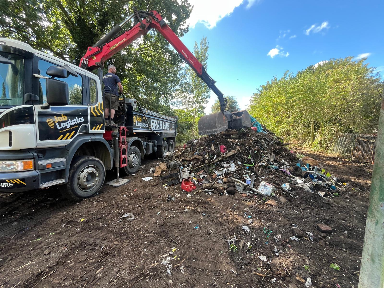 The process of removing the large pile of fly-tip