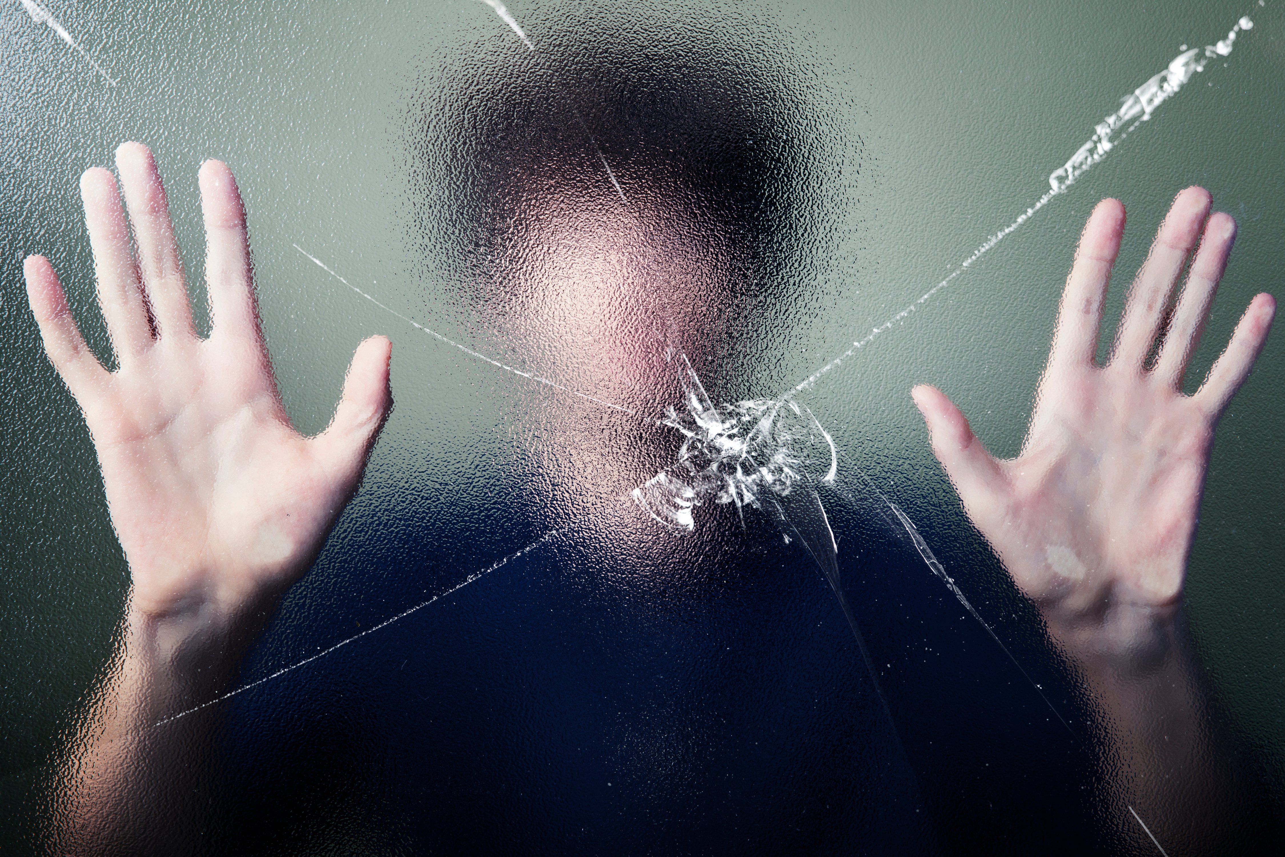 anonymous-man-with-cracked-glass-effect