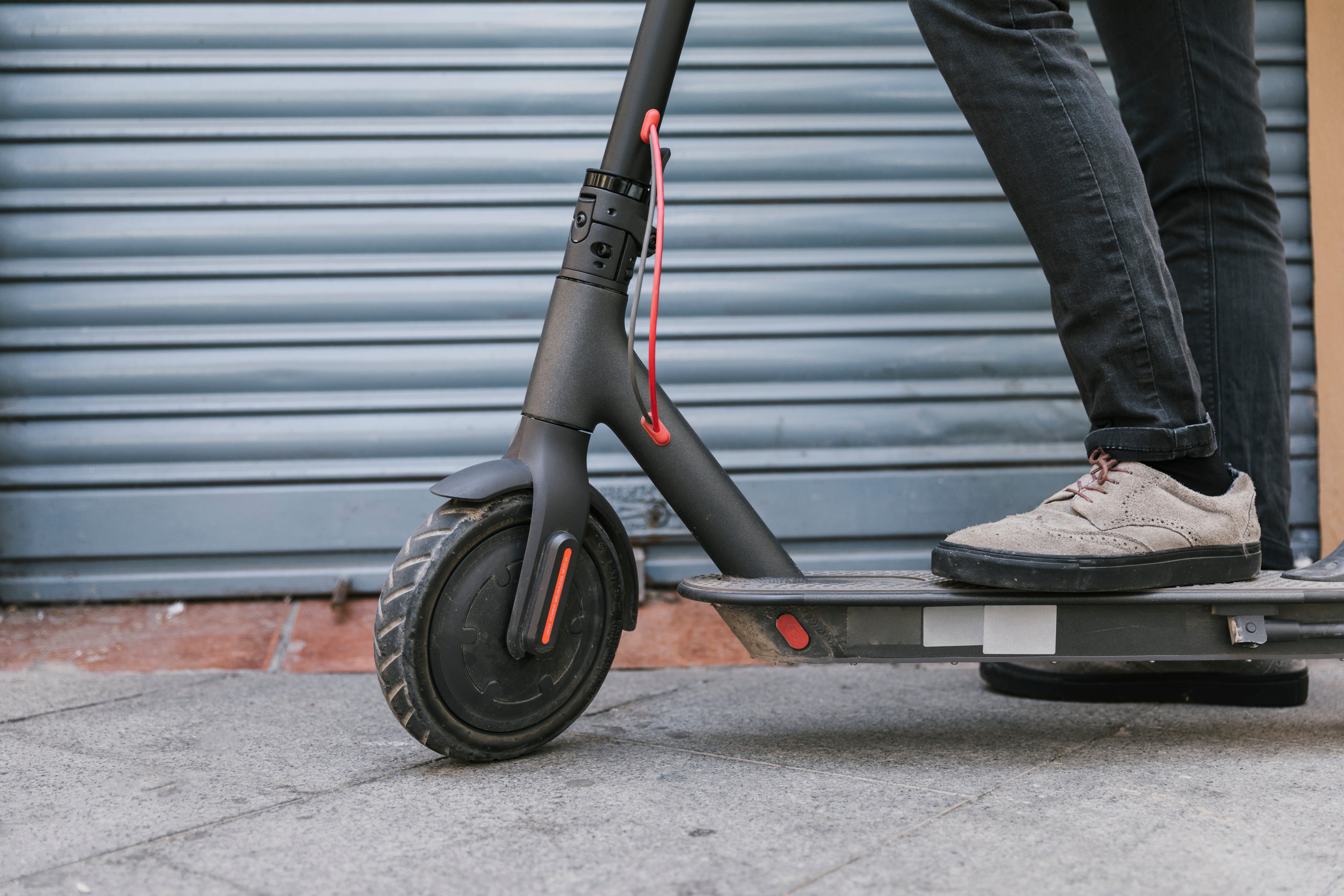 bottom-view-e-scooter-rider-taking-break