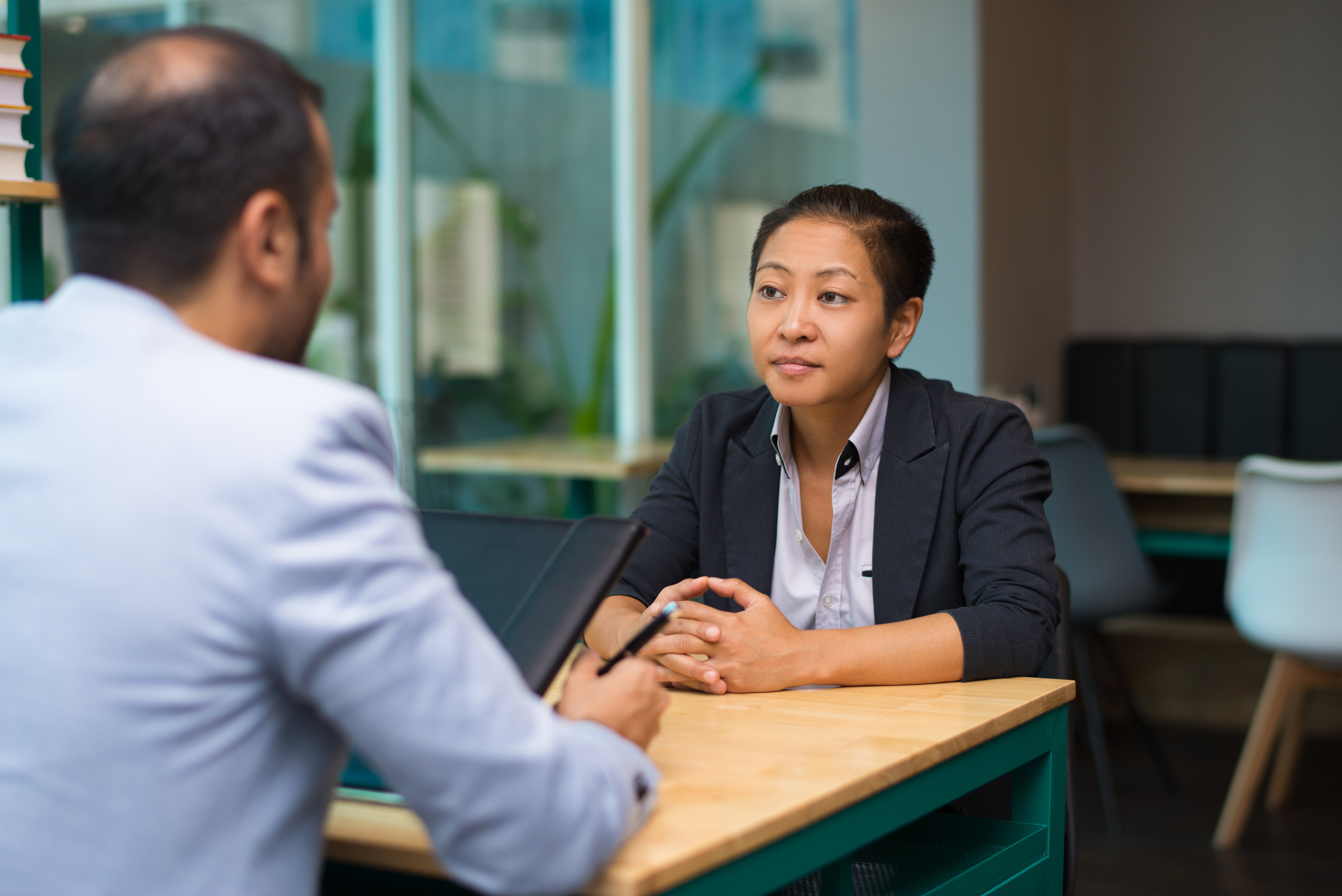 serious-asian-woman-meeting-with-business-partner