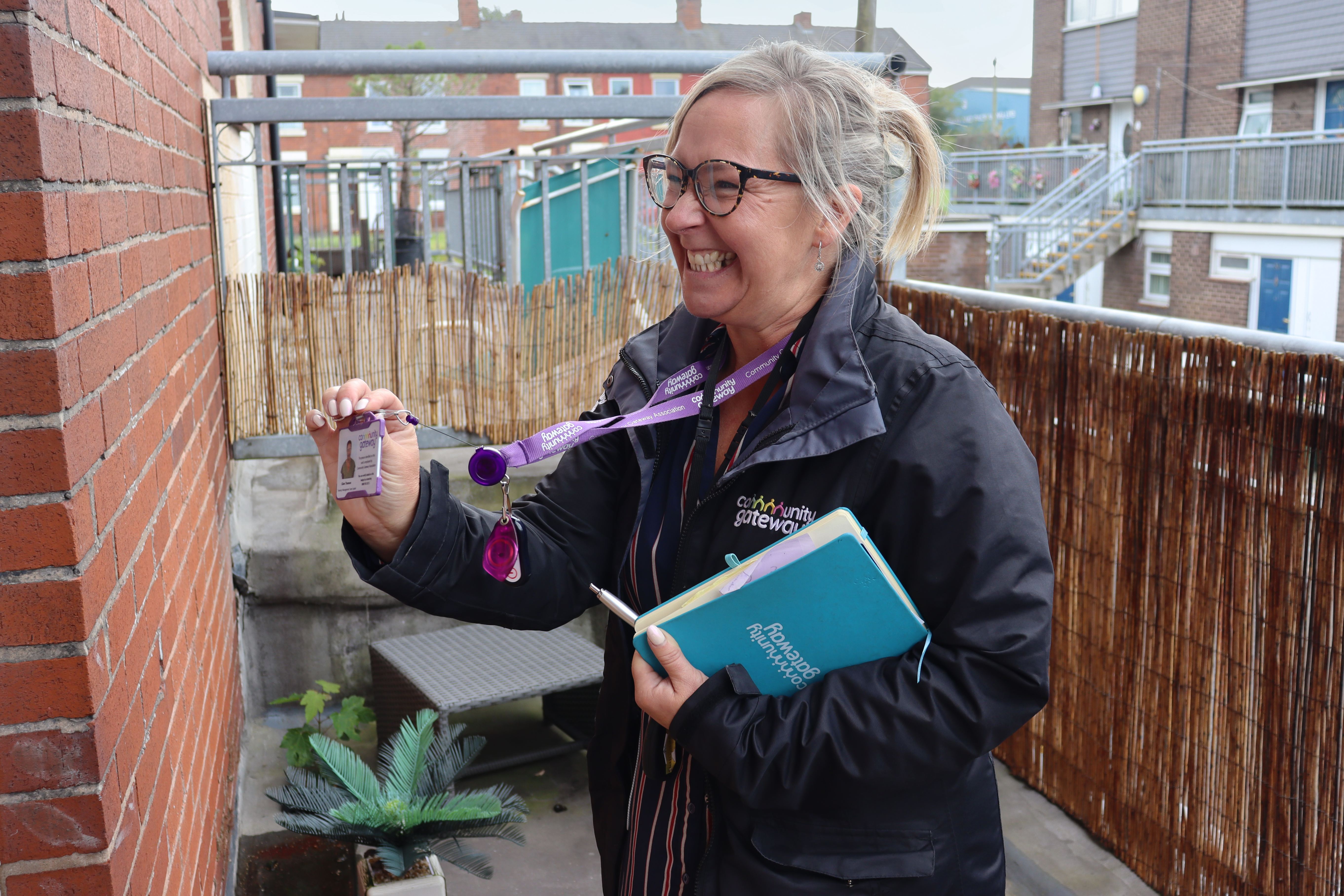 A CGA colleague showing their ID.