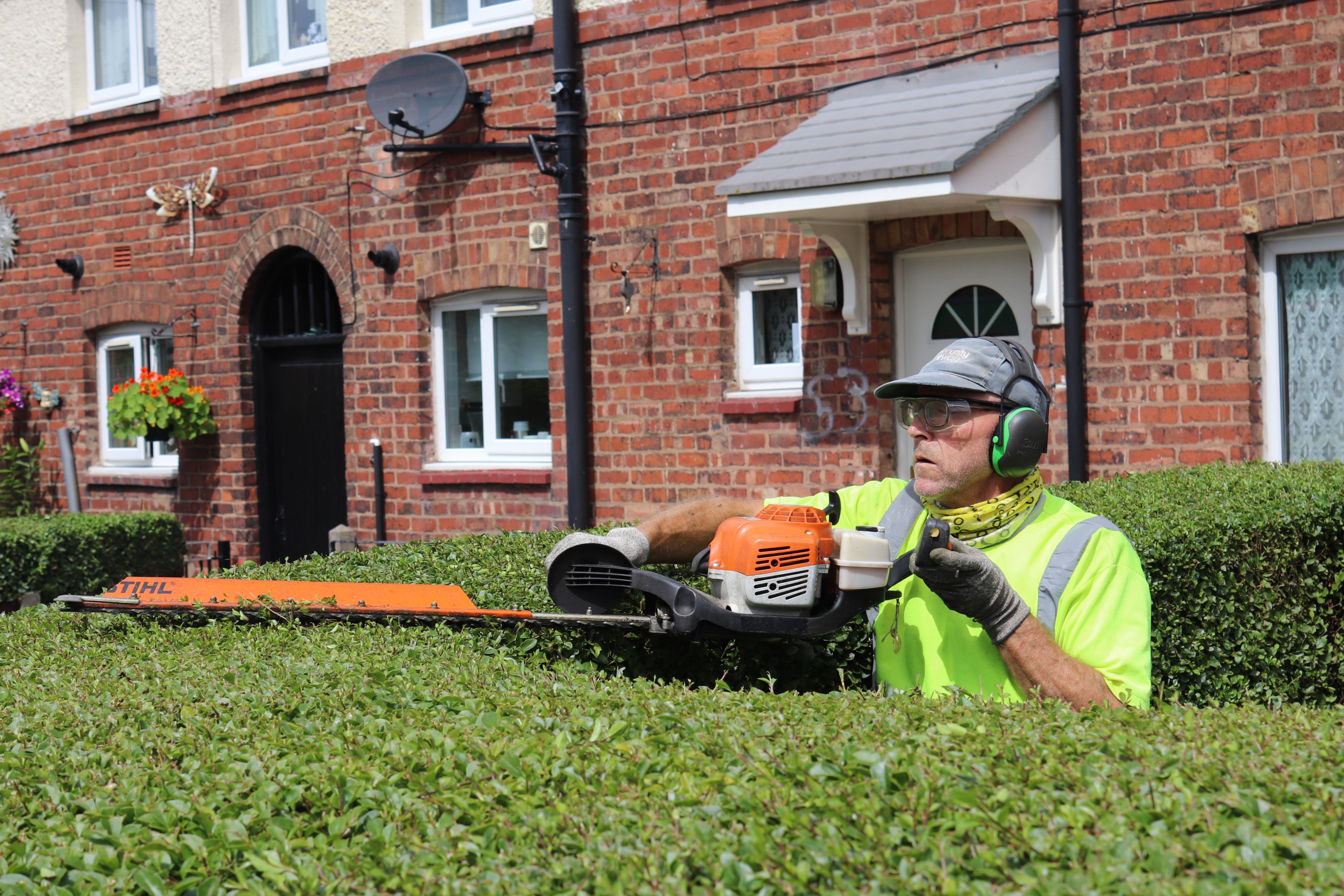 Community Gateway green care colleague cutting hedge