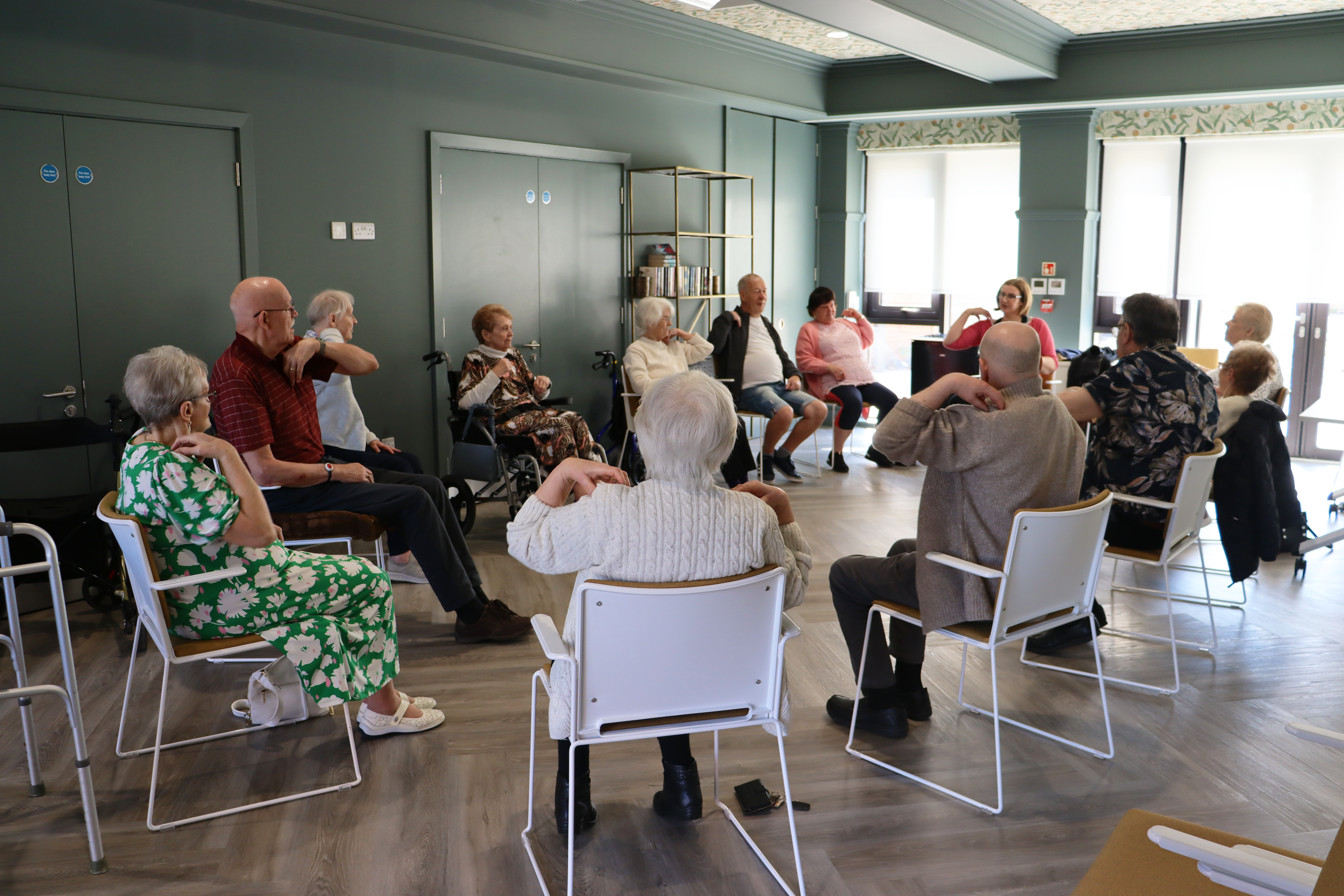 Tenants doing an arm chair activity