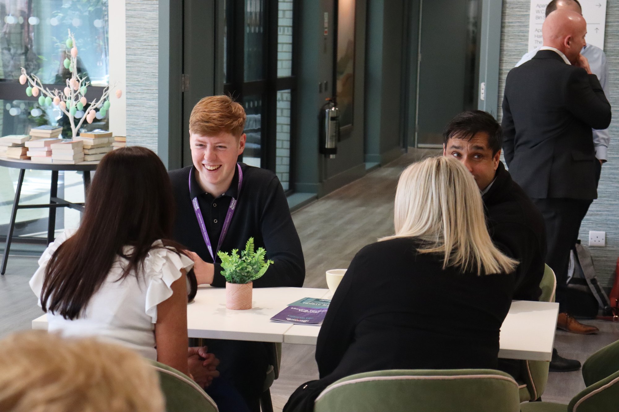 Community Gateway staff having a discussion at our Extra Care Scheme the Atrium.