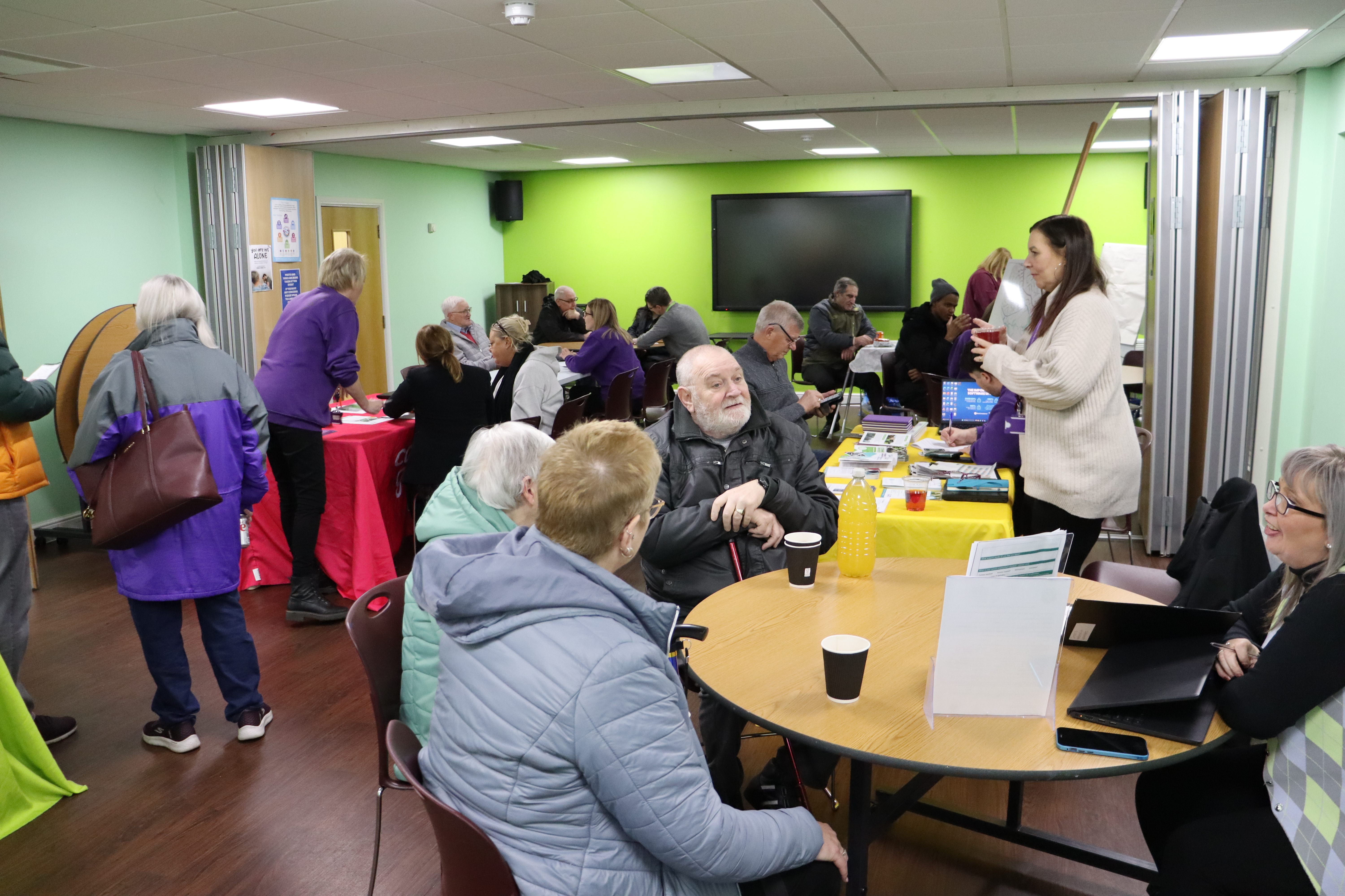 Tenants and CGA colleagues chatting at the event