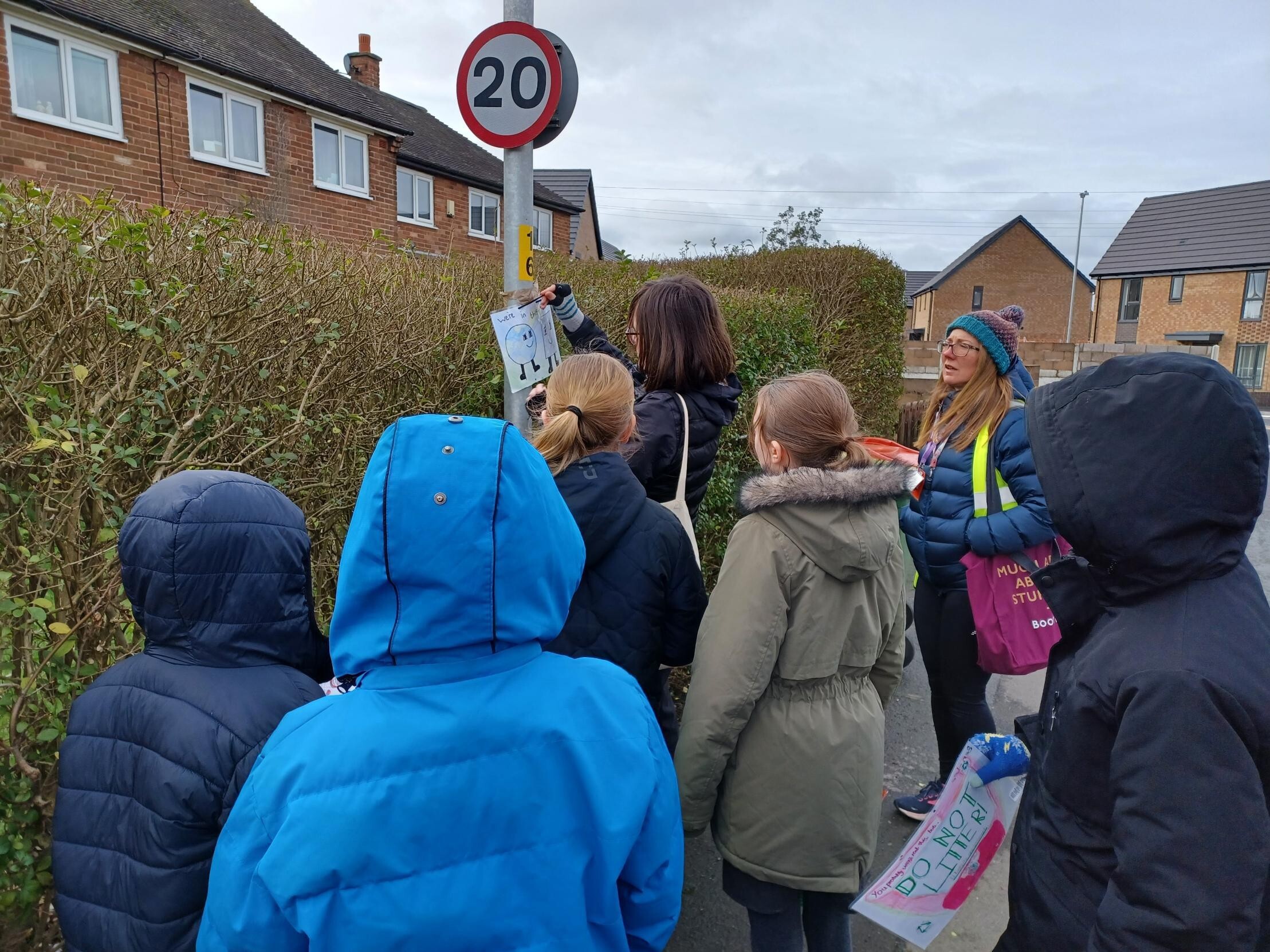 Putting up posters around the community