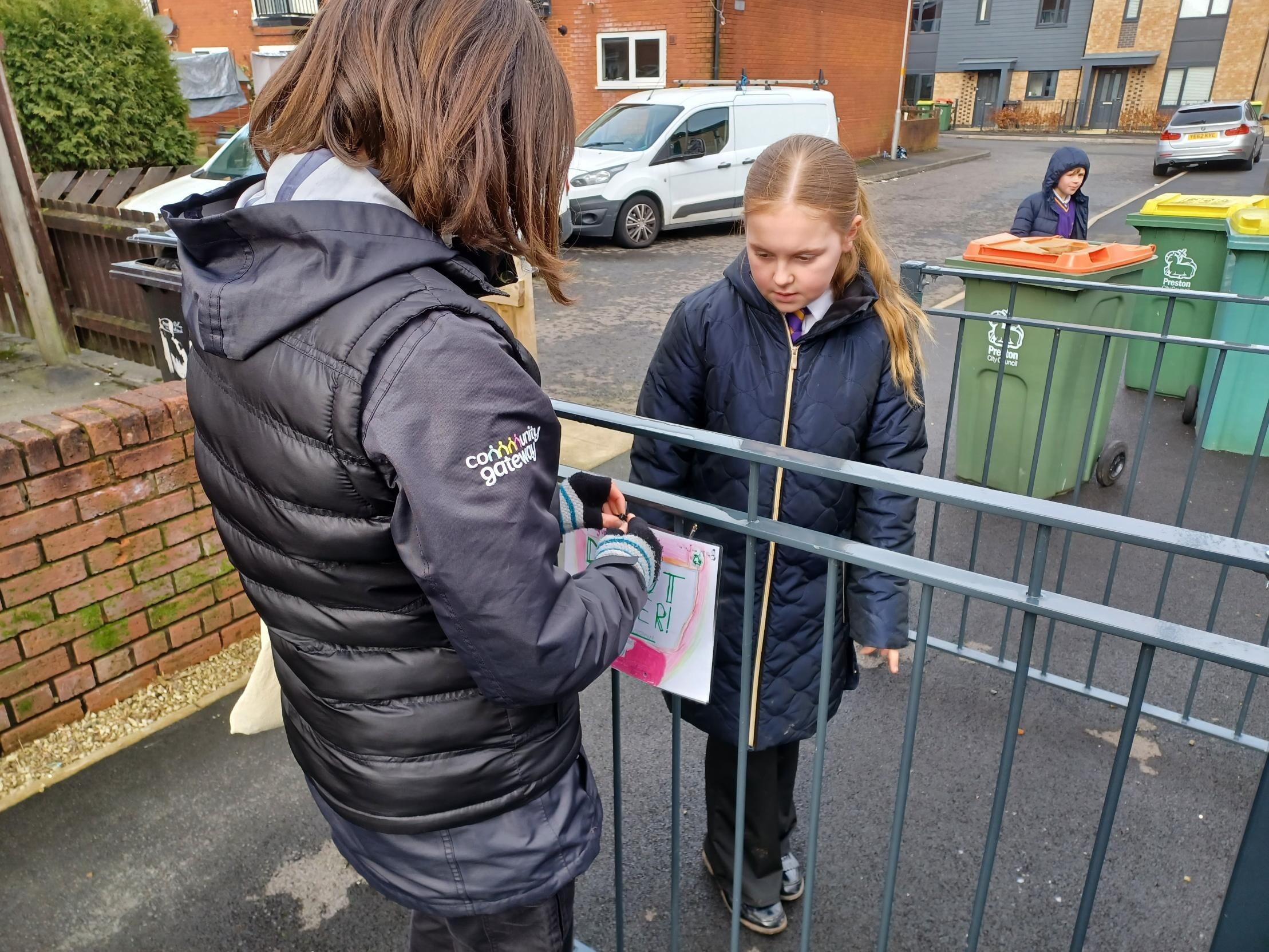 Putting up posters around the community