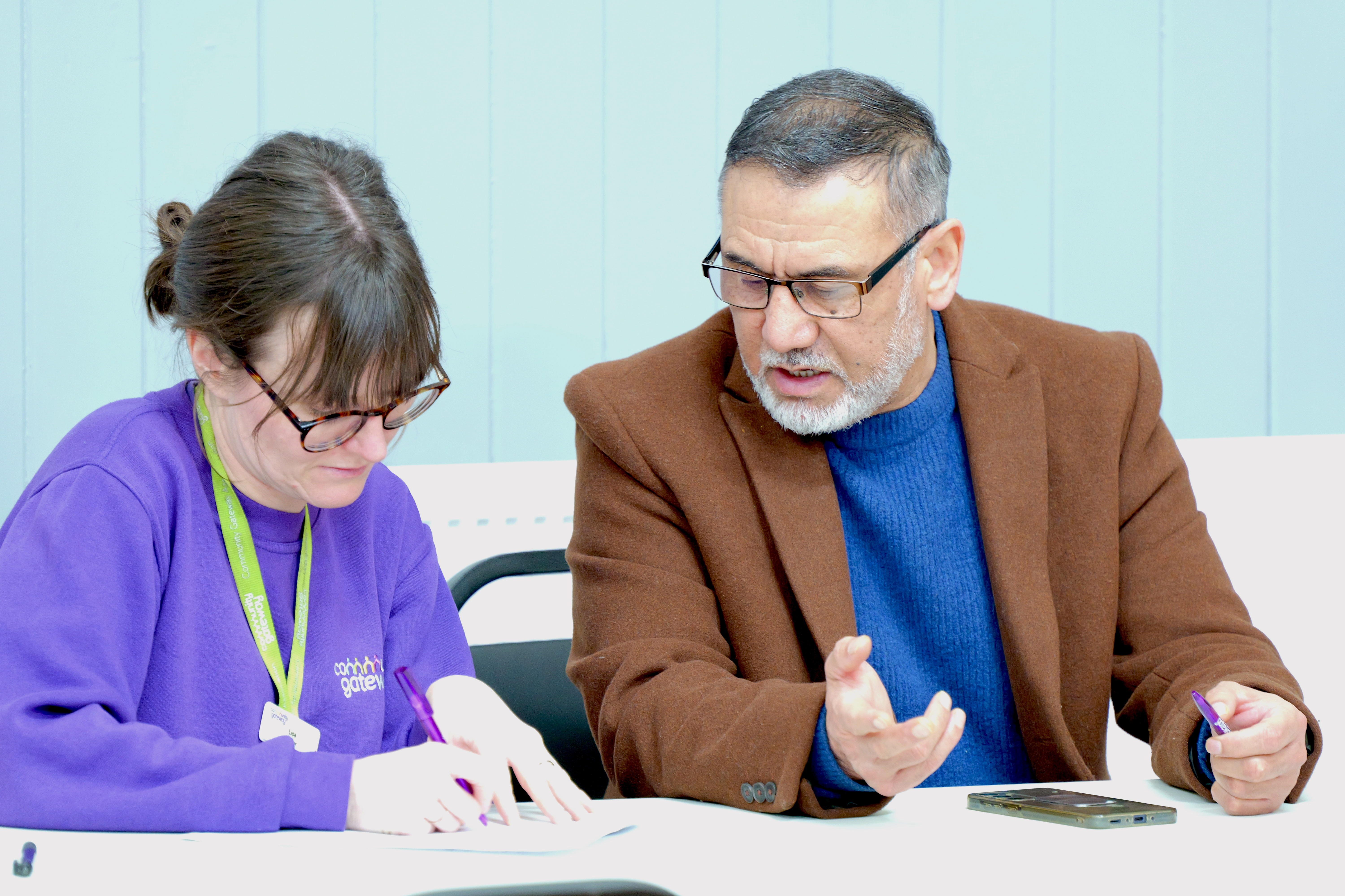 A tenant and a team member from Community Gateway