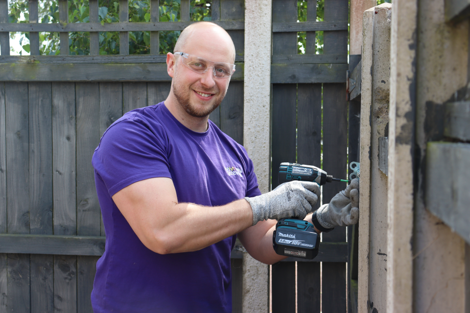 Picture of colleague with a tool 