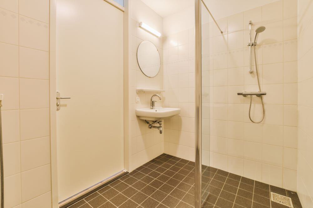 Showing a level access shower in a bathroom at one of community gateway's properties